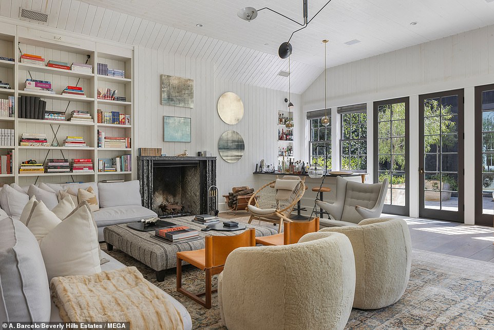 85679673-13491549-The_living_room_is_ideal_for_hosting_with_a_wood_burning_firepla-a-4_1717473053189