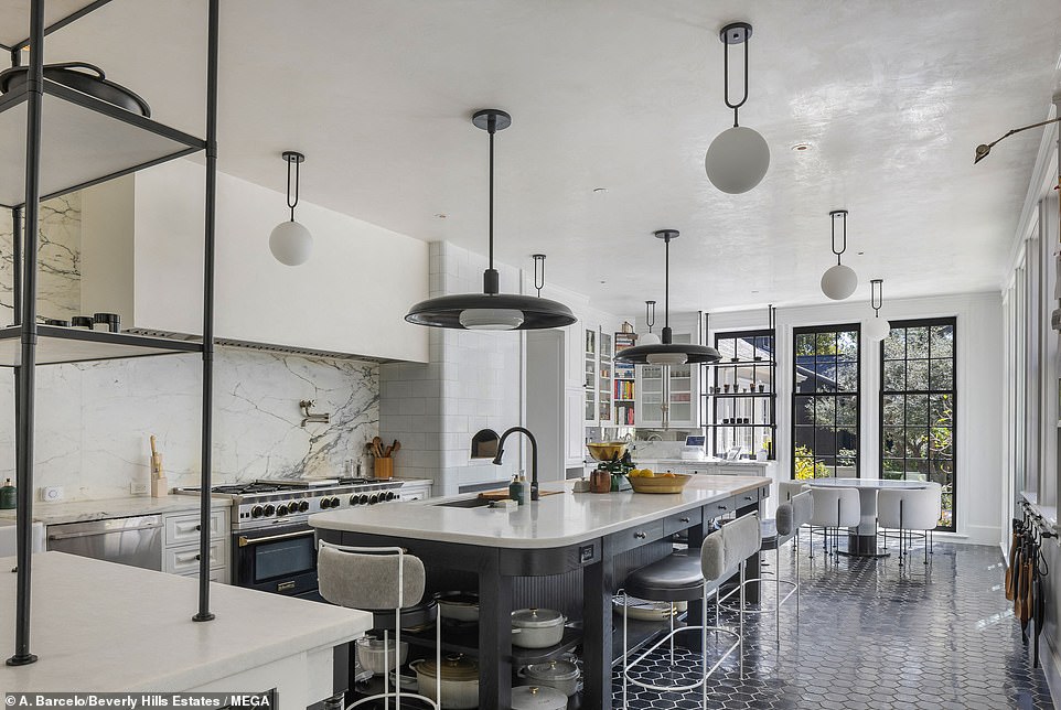 85679675-13491549-The_kitchen_is_every_chef_s_dream_featuring_high_ceilings_floor_-a-3_1717473053180